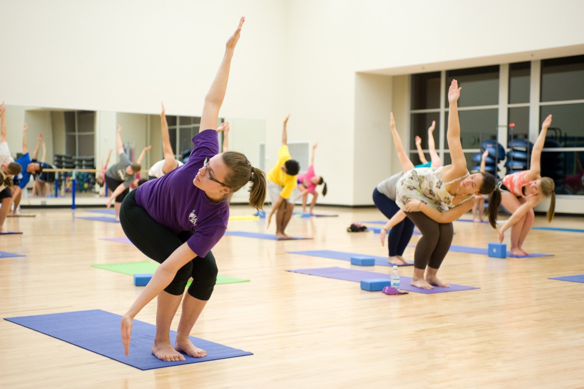 A group of people practicing yoga